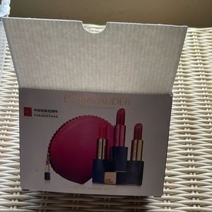 NWOT ESTEE LAUDER 3 lipsticks with small make up case.